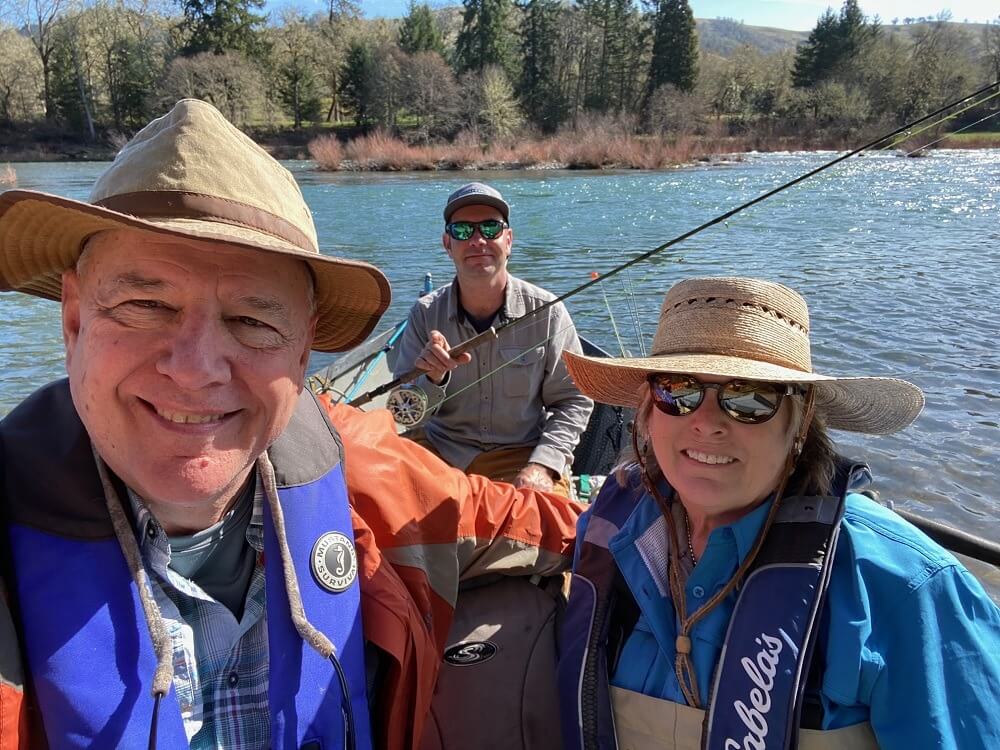 Flyfishers with guide in a boat. Click to view Google Photos album.